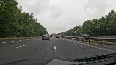 cars driving on a rainy highway in birmingham