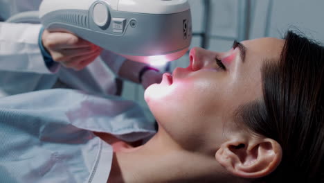 woman undergoing a light therapy facial treatment