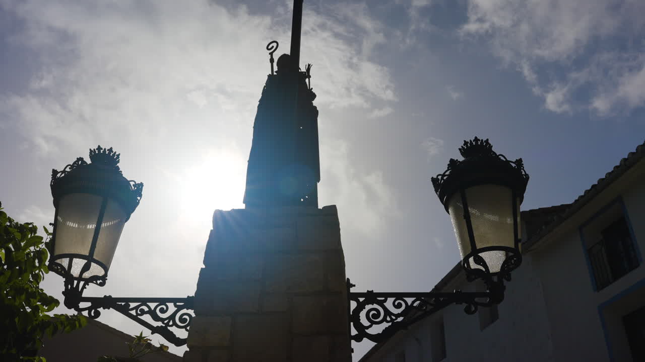 Silhouette of a monument with ornate street lamps