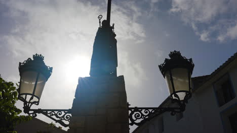silhouette of a monument with ornate street lamps