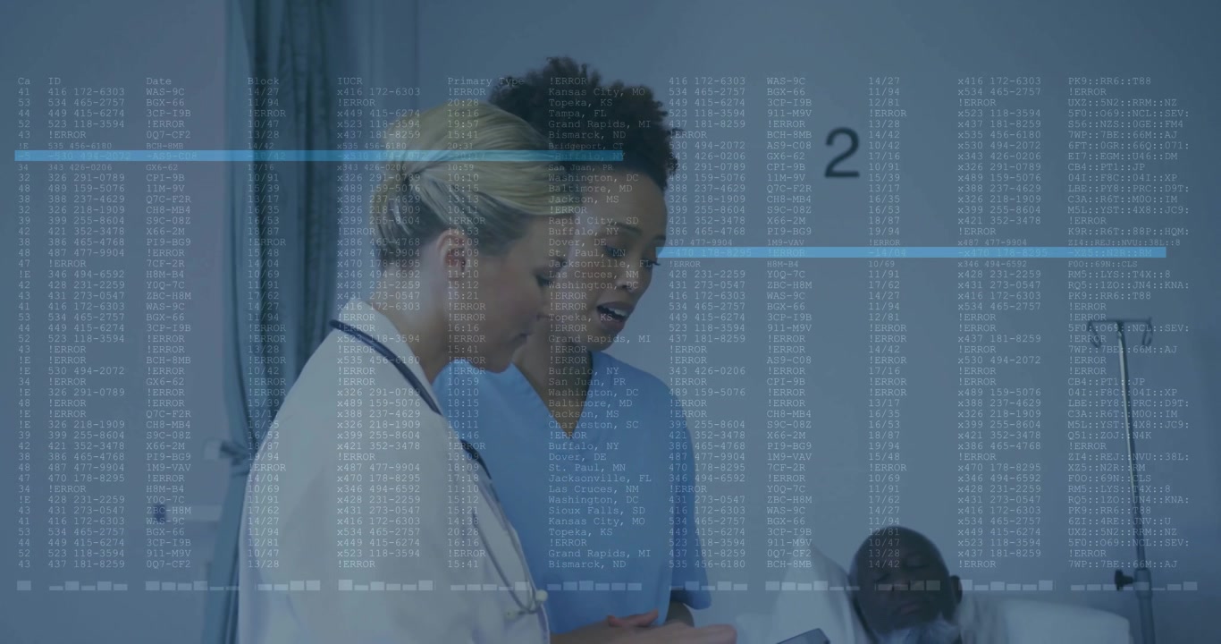 Medical Professionals Reviewing Patient Data on Tablet in Hospital Room