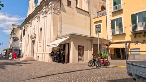 people and vehicles in a bustling town square