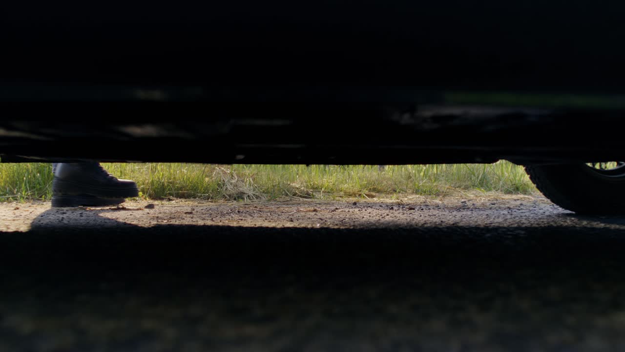 View from Underneath Car with Boots