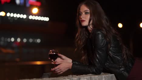 woman with wine at night