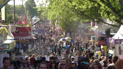 crowds taking in the food, music, entertainment, rides and exhibits at the pacific national exhibition.