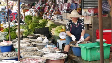 asian woman working in the fish market