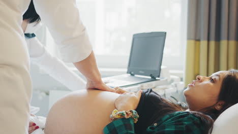 pregnant woman undergoing ultrasound examination