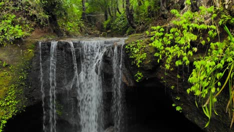 suwat waterfall cascades in the rainforest near ubud in bali, indonesia