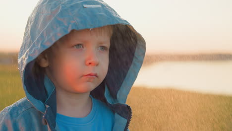 child eyes reflect sadness under rain tears mingle with raindrops on toddler cheeks mirroring