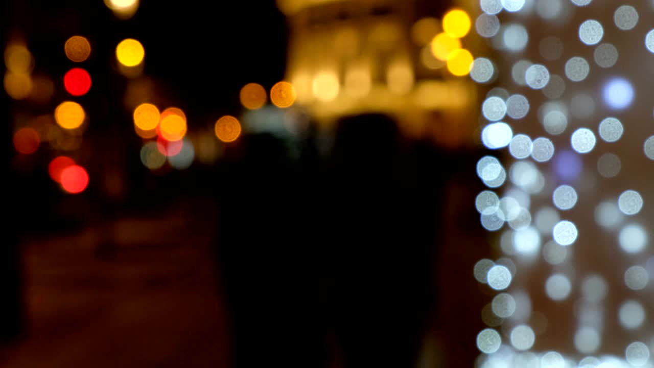 blurred urban landscape with walking people and riding cars