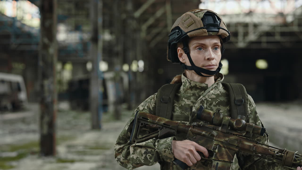 Female Soldier in Camouflage Uniform in Abandoned Building