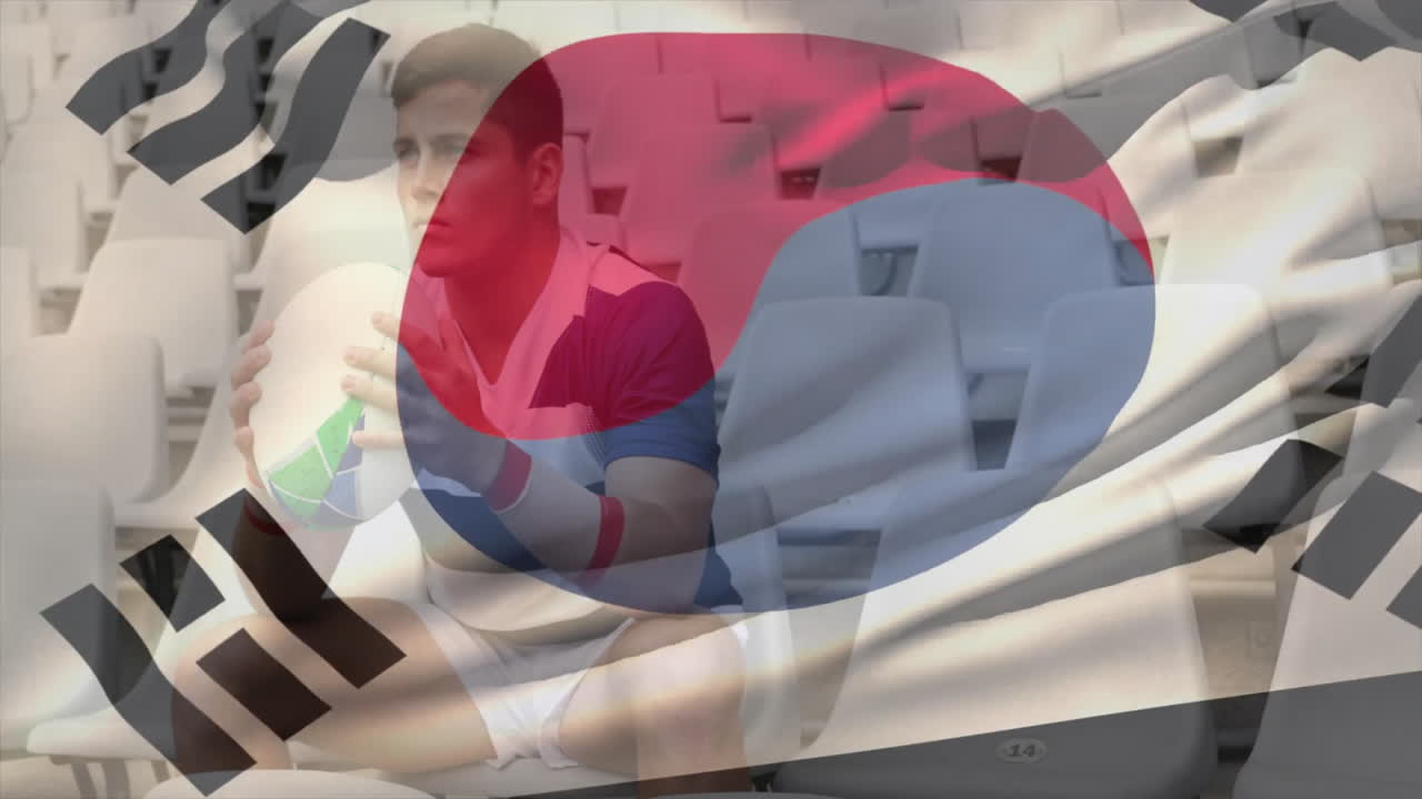 Sitting in empty stadium, rugby player with South Korean flag animation overlay