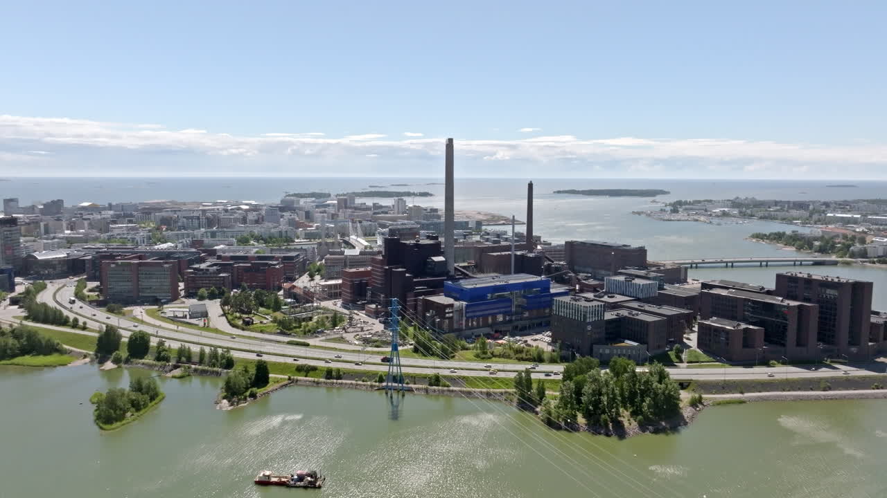 Aerial tracking shot of the Ruoholahti district, sunny, summer day in Helsinki