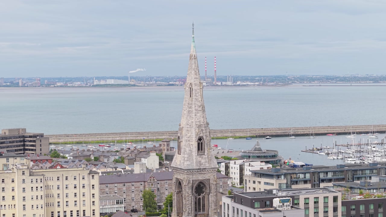 Poolbeg Chimneys And West Harbour Seen From Dun Laoghaire Suburban Town With Bell Tower Of St. Michael’s Church In Ireland. - aerial shot