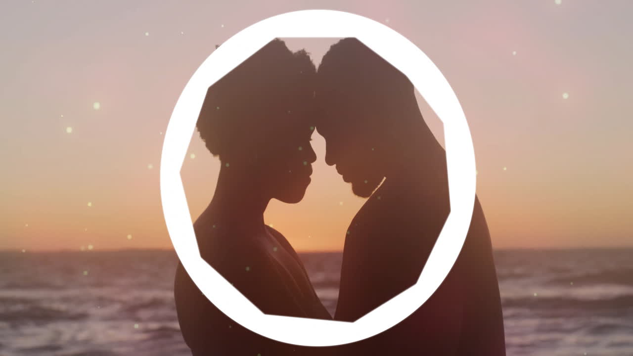 Embracing couple at sunset with circular animation overlay, creating romantic scene