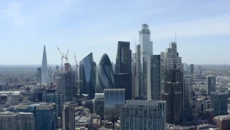 Low-circling-shot-of-imposing-London-skyscrapers