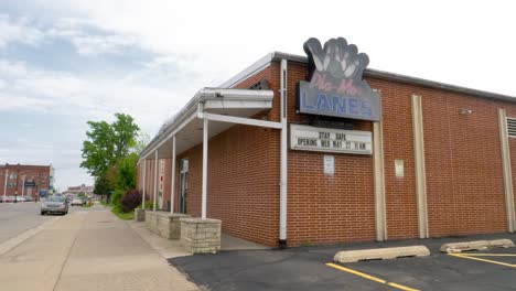 Vintage-Bowling-Alley-Building-Exterior,-Tilting-Shot