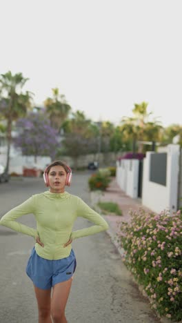 woman running outdoors with headphones