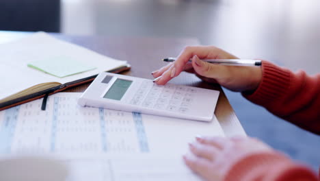 finance, writing and calculator with hands