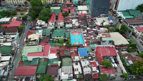 lower class living in quezon city, simple houses, basketball court, aerial flyover