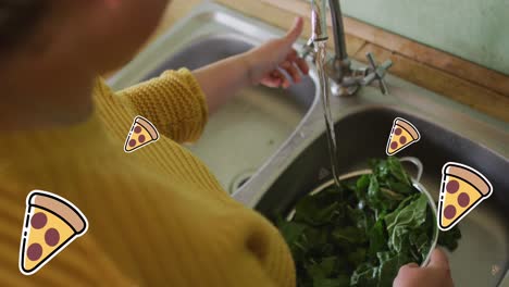 Animation-of-pizza-icons-over-caucasian-woman-washing-salat