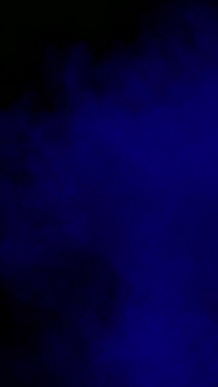 Blue smoke cloud on black background