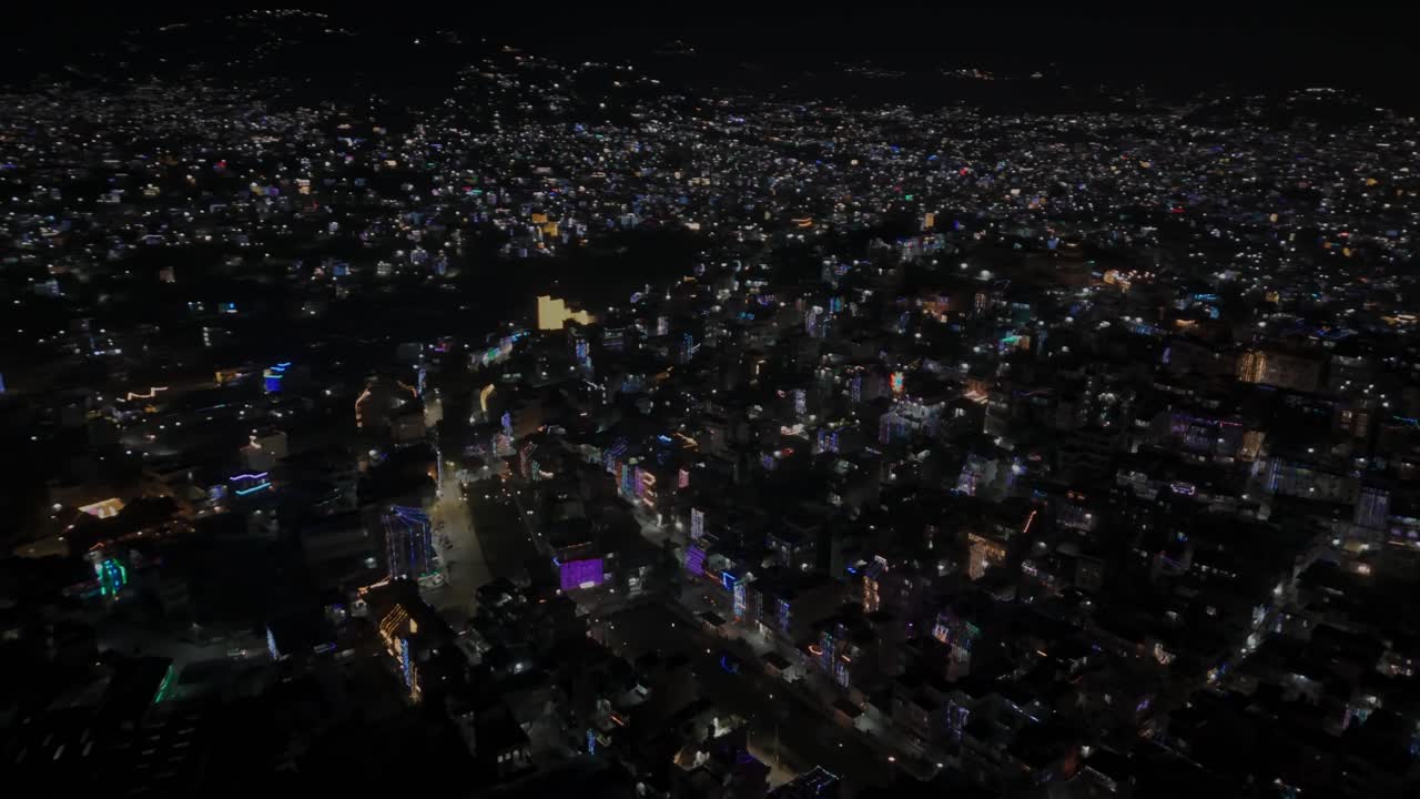 Aerial night drone footage of Kathmandu and Kirtipur during Diwali (Tihar), showing cities illuminated with colorful lights and decorations that reflect Nepal’s joyful culture and festive spirit