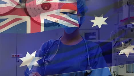 Digital-composition-of-australia-flag-waving-over-female-health-worker-wearing-face-mask-at-hospital