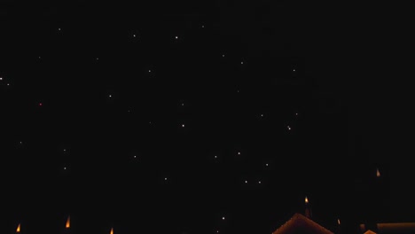 view of multiple fireworks explosives and display on a quiet clear night