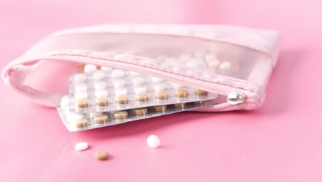 pink pouch with birth control pills