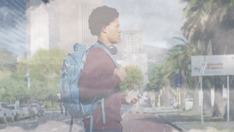 animation of clouds over african american businessman walking