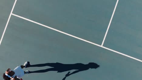 video of top view of biracial female tennis player on court