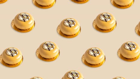 pattern with many bright round desserts of orange and golden color with biscuits animated on a yellow background, side view. cakes move in different directions, 4k