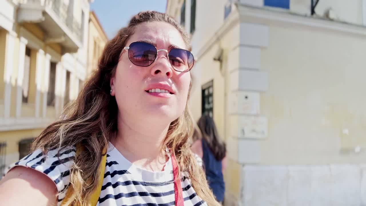 Young Tourist Woman Looking Up at City Architecture, Athens, Greece