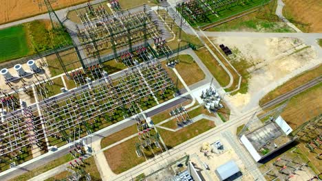 electrical transformer substation in summer landscape - aerial drone shot