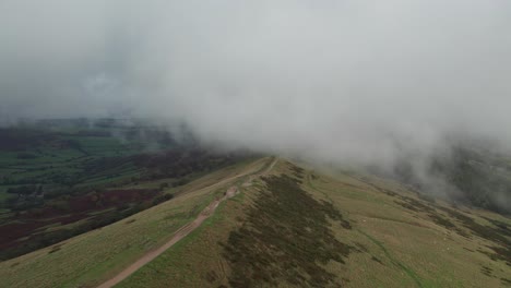 low clouds above mam tor, peak district, in slow motion