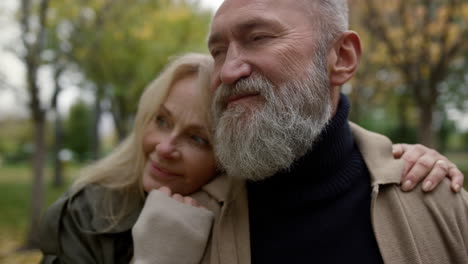 portrait of loving beautiful senior couple enjoying each other outside.