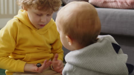 little kids playing with magnetic balls