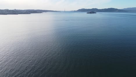 aerial footage slowly zooming out of the sea around treasure island