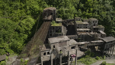 Rusty-freight-cableway-cables-and-platform-in-abandoned-mining-factory