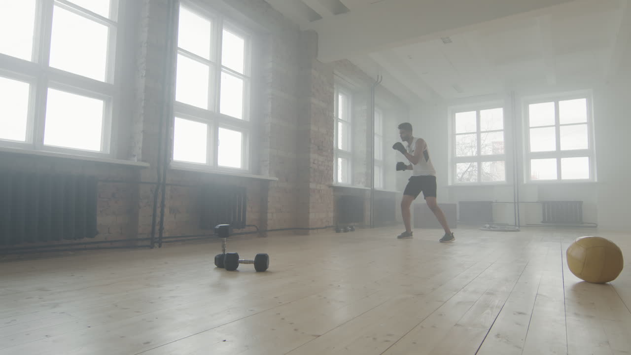 African American Sportsman At Boxing Training