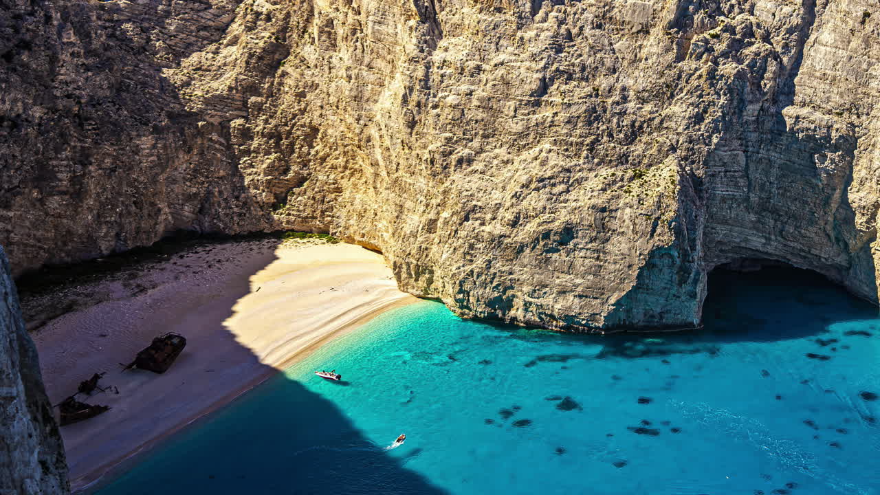 Aerial of famous Shipwreck Beach, Navagio, with sheer cliffs and turquoise water