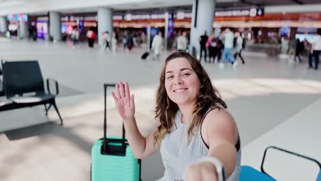 young woman with luggage waiting for departure