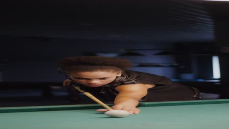 woman playing pool