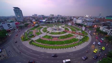 wongwian yai roundabout. aerial view of highway junctions at sunset. roads shape circle in structure of architecture and technology transportation concept. top view. urban city, bangkok, thailand.