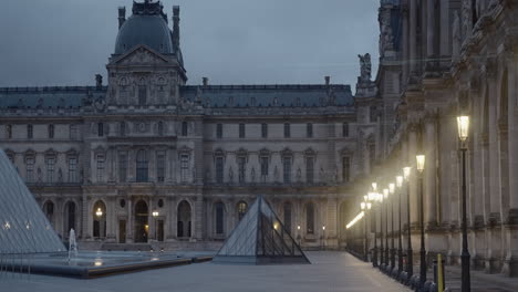 the louvre museum in paris at dawn