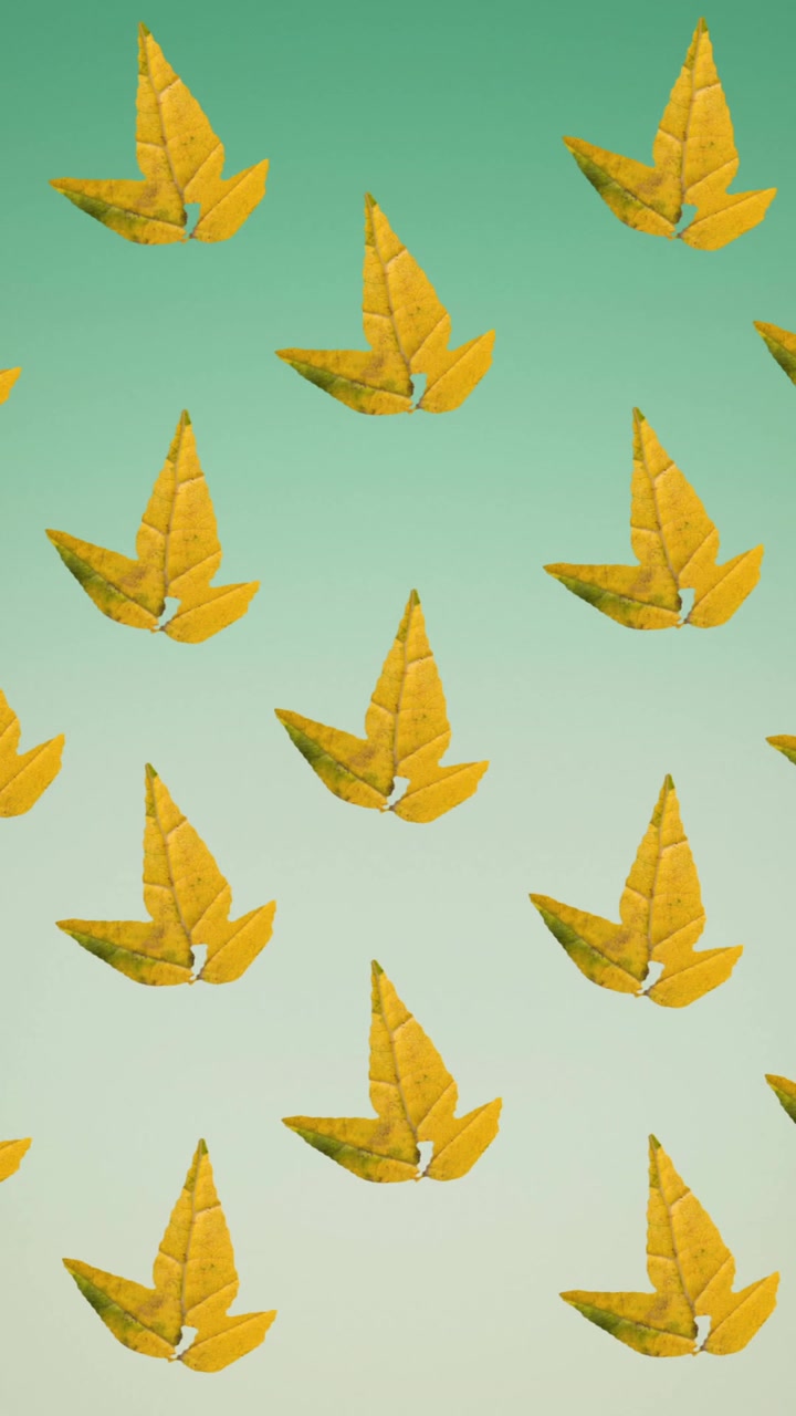 Animation of rows of autumn yellow leaves on green background