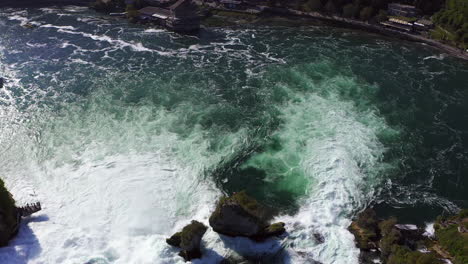 slow motion: revealing aerial shot of the roaring waterfall rheinfall at schaffhausen in switzerland