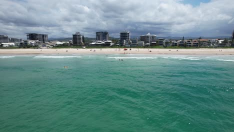 palm beach surf club 7th ave - southern gold coast - queensland qld - australia - pan around rotating drone shot