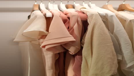 close up of clothing on hangers in a closet